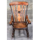 An antique wooden rocking chair.93 x 57 x 72 cm.