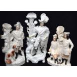 A collection of Staffordshire flat back figures in the form of Cavaliers. Largest 46cm. (3)