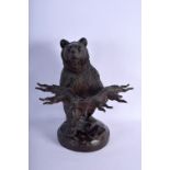 A 19TH CENTURY BAVARIAN BLACK FOREST LIQUOR GLASS HOLDER modelled as a standing bear. 32 cm x 19 cm.