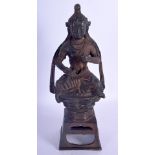 A CHINESE BRONZE FIGURE OF A SEATED BUDDHISTIC DEITY 20th Century, modelled holding their robes. 25