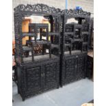 A FINE PAIR OF 19TH CENTURY CHINESE CARVED HONGMU DISPLAY CABINETS Qing, decorated with foliage and