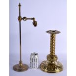 A VINTAGE ADJUSTABLE BRASS LAMP and an embossed candlesticks. Largest 48 cm high. (2)