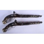 A PAIR OF 19TH CENTURY SYRIAN OTTOMAN TURKISH DUELLING PISTOLS with silver inlaid foliage and vines.