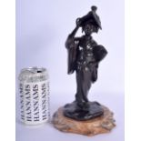 A 19TH CENTURY JAPANESE MEIJI PERIOD BRONZE OKIMONO modelled as a female holding her hat. Bronze 23.