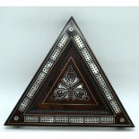 A rare triangle shaped wooden 19th century cribbage board with mother of pearl inlay. 32cm.