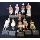 A collection of Indian terracotta Company school figures with stands 26cm (10)
