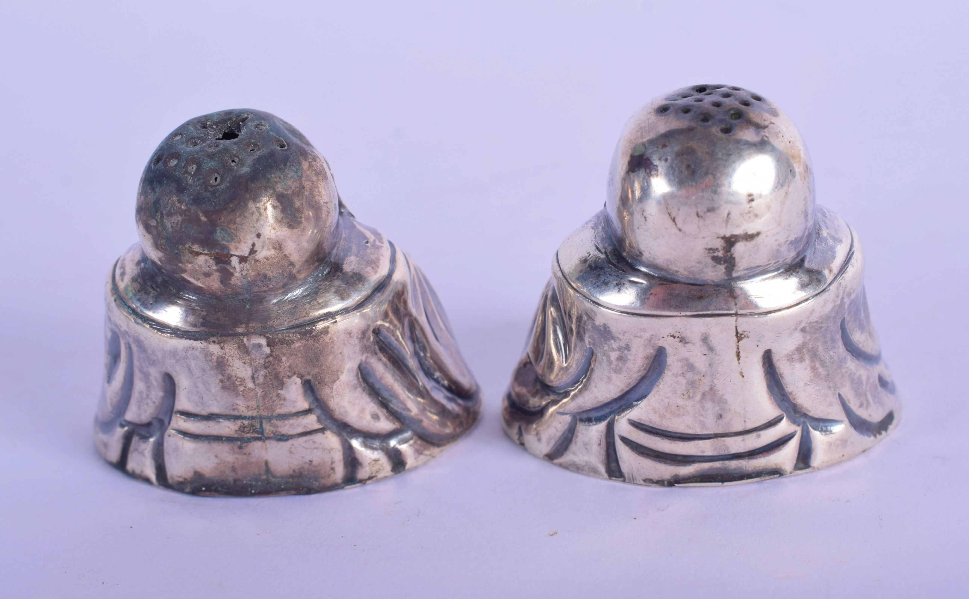 A PAIR OF CHINESE SILVER CONDIMENTS IN THE FORM OF BUDDHA. 4cm x 4.5cm x 2.5cm, weight 43g - Image 2 of 4