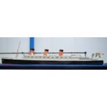 A VERY LARGE MID 20TH CENTURY PAINTED SCRATCH BUILT MODEL BOAT OF THE QUEEN MARY modelled upon a pai