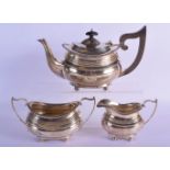 AN ANTIQUE HARLEQUIN THREE PIECE SILVER TEAPOT. 1070 grams. Birmingham 1915 and Chester. Largest 28