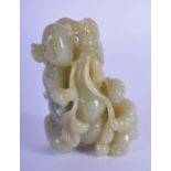 A 2TH CENTURY CHINESE GREEN JADE CARVING OF A MAN AND BOY. 7cm high