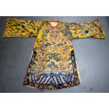 A 19TH CENTURY CHINESE IMPERIAL YELLOW SILK EMBROIDERED ROBE Qing, decorated with dragons, clouds an