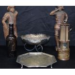A miscellaneous collection of silver plate; vintage oil lamp, beer bottle & two wooden figures. 14 x