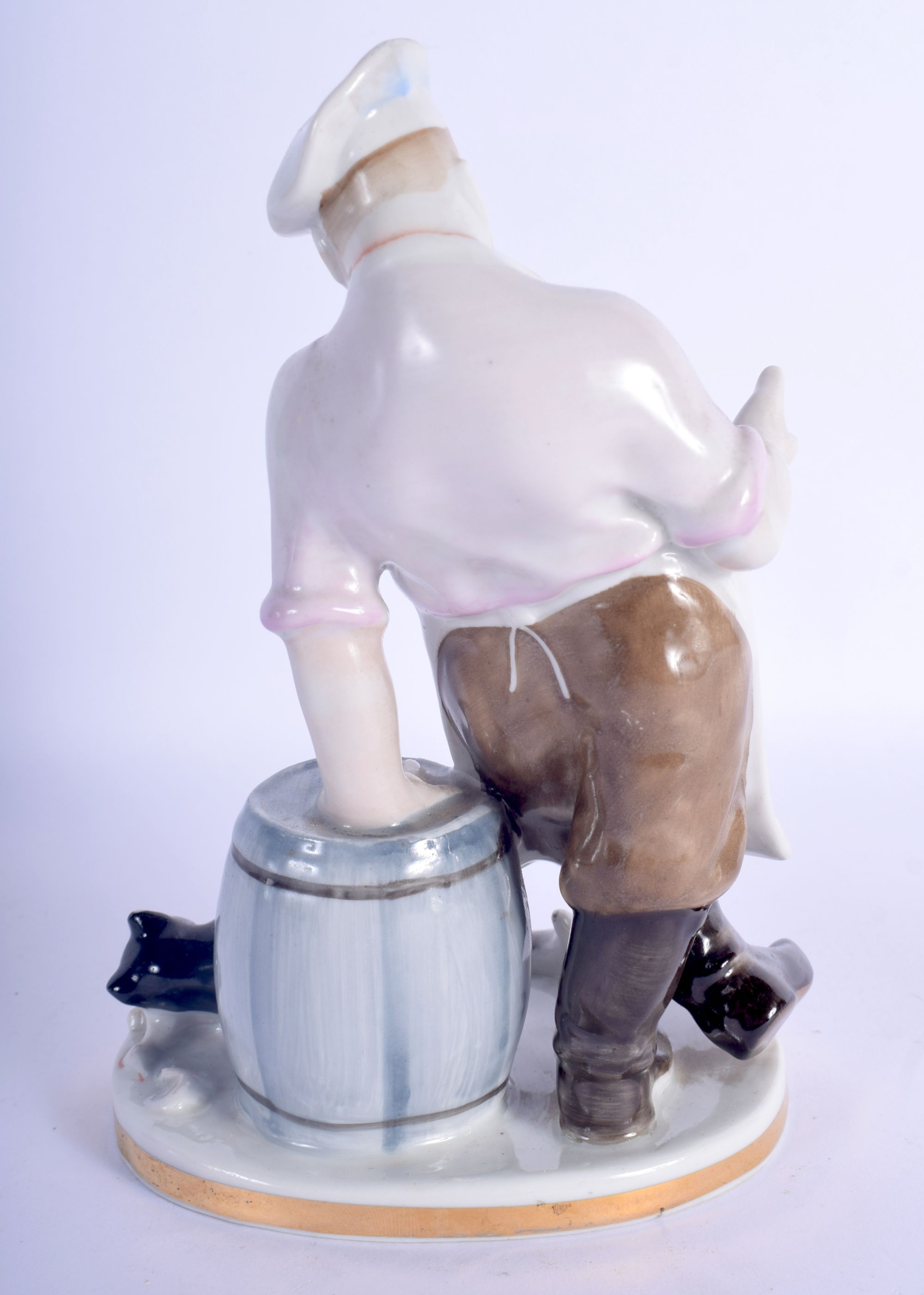 A USSR PORCELAIN FIGURE OF A CHEF modelled beside a cat. 19 cm high. - Image 2 of 3