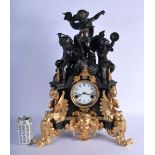 A LARGE CONTEMPORARY BRONZE AND GILT BRONZE MANTEL CLOCK formed as figures playing instruments. 54 c