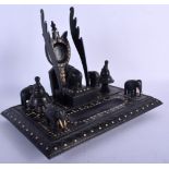 AN ANTIQUE ANGLO INDIAN CARVED EBONY AND BONE ELEPHANT DESK STAND. 24 cm x 18 cm.
