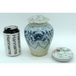 A Chinese porcelain lidded vase decorated with foliage, together with a small polychrome Chinese lid