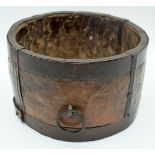 A 19th century metal bound and carved wooden bucket possibly for grain 15 x 23cm.