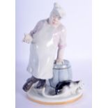 A USSR PORCELAIN FIGURE OF A CHEF modelled beside a cat. 19 cm high.