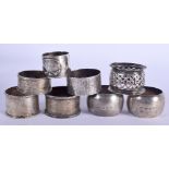 EIGHT ASSORTED NAPKIN RINGS with assorted hallmarks from 1901 - 1967. 178g (8)