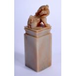 AN ANTIQUE CHINESE SOAPSTONE SEAL WITH A CARVED TEMPLE DOG. 8.4cm high, 2.6cm wide