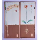 A PAIR OF CHINESE COPPER FRAMED POTTERY TILES 20th Century, flowering shrubs. 60 cm x 24 cm.