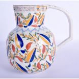 A TURKISH OTTOMAN KUTAHYA FAIENCE TYPE JUG painted with flowers. 16.5 cm high.