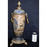 A large Royal Doulton Lambeth Ormolu mounted oil lamp converted to an electric lamp. 50cm (2)