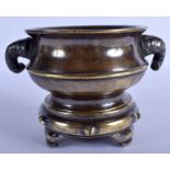 AN 18TH/19TH CENTURY CHINESE TWIN HANDLED BRONZE CENSER AND STAND Qing, bearing Studio mark to base.
