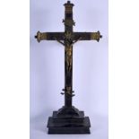 AN EARLY EUROPEAN BRASS AND WOOD CRUCIFIX possibly 17th century. 44 cm x 22 cm.