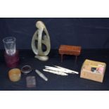 A miscellaneous collection of ivory instruments, a cased glass measuring tumbler, a cased corkscrew,