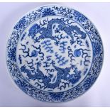A 19TH CENTURY CHINESE BLUE AND WHITE PORCELAIN PLATE Guangxu, painted with dragons and flaming pear