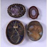 FOUR ANTIQUE OVAL PLAQUES WITH VARIOUS INSERTS. Largest 3.6cm x 2.8cm, weight 16.7g N(4)