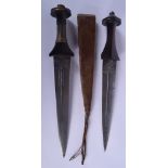 TWO EARLY 20TH CENTURY CONTINENTAL KNIVES one with animal skin sheath. Longest 37 cm. (2)