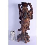 A LARGE 20TH CENTURY CHINESE CARVED ROOTWOOD FIGURE OF A MALE modelled holding a fan. 45 cm high.