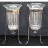 A vintage pair of large glass candle holders in fitted metal stands .42cm (2)