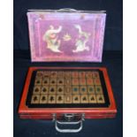 A cased set of bamboo and bone Mahjong tiles. 32 x 22cm