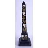 A MID 19TH CENTURY DERBYSHIRE BLACK MARBLE OBELISK decorated with foliage. 29 cm high.