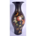 A LARGE EARLY VICTORIAN BLACK LACQUER VASE painted with a bird amongst foliage. 27 cm high.