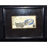 A small framed Japanese carved & painted ivory panel depicting a prone male. 5 x 10cm