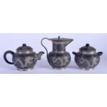 AN EARLY 20TH CENTURY CHINESE PEWTER OVERLAID YIXING TYPE TEAPOT AND COVER Late Qing/Republic. Large