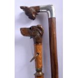 AN ANTIQUE BAVARIAN BLACK FOREST BRIGG WALKING CANE together with another. Largest 90 cm long. (2)