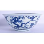 A CHINESE BLUE AND WHITE PORCELAIN BOWL 20th Century, painted with dragons amongst clouds. 21 cm dia