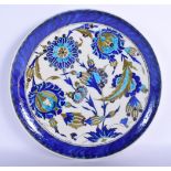 A LARGE TURKISH OTTOMAN IZNIK FAIENCE CIRCULAR POTTERY DISH painted with floral sprays. 30 cm diamet