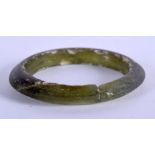 A VERY RARE CHINESE DARK GREEN GLASS BANGLE Tang Dynasty, of plain form. 6.25 cm wide.
