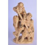 A 19TH CENTURY JAPANESE MEIJI PERIOD CARVED IVORY OKIMONO modelled with figures upon a horse. 12 cm
