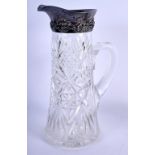 A LARGE SILVER MOUNTED CUT GLASS CLARET JUG. 27 cm high.