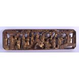 A 19TH CENTURY CHINESE CARVED TEMPLE PANEL depicting figures. 30 cm x 10 cm.