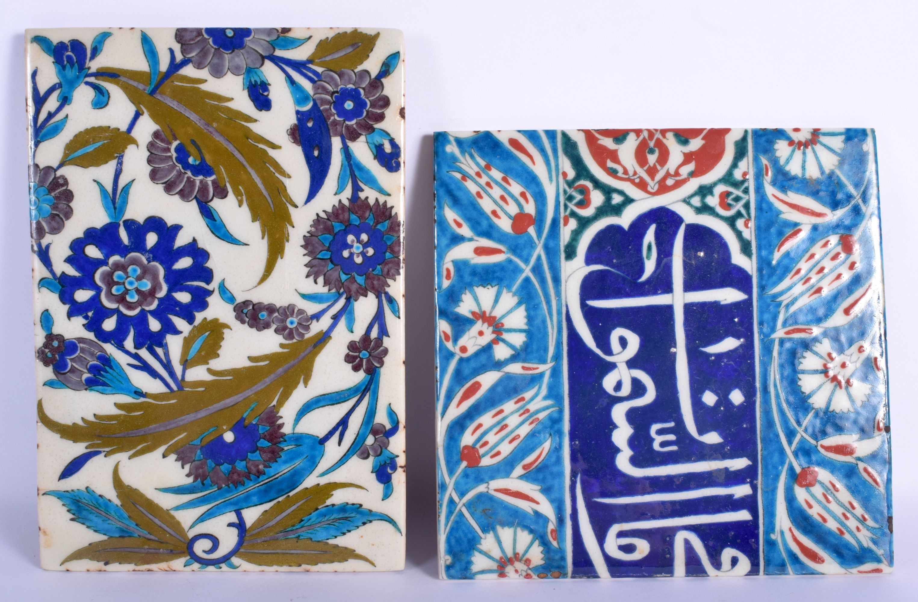 TWO TURKISH OTTOMAN IZNIK FAIENCE POTTERY TILES painted with floral sprays. Largest 24 cm x 14 cm. (