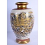 A LATE 19TH CENTURY JAPANESE MEIJI PERIOD SATSUMA VASE painted with landscapes. 25 cm high.