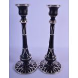 A PAIR OF ART NOUVEAU SILVER OVERLAID GLASS CANDLESTICKS overlaid with foliage. 27 cm high.